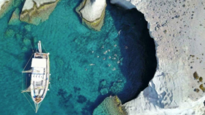 Clear waters beneath the boat, offering a window to the sea