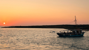 Half-day Sunset Cruise from Paros to the Blue Lagoon of Panteronisi on a Traditional Boat photo