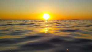 Feel the calm of the evening sea as stars begin to appear