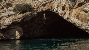 If the weather allows it and you visit the bay of Rina, try the cliff jump from the top of  cave!