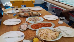 Savor a freshly prepared on-board meal made from the day’s catch