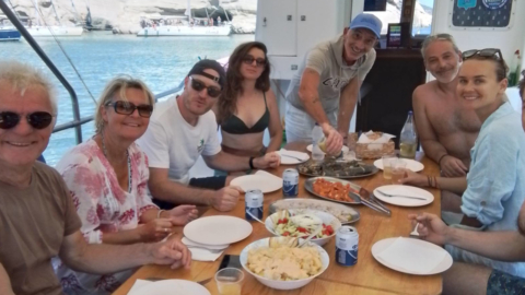 Capture moments of laughter and joy during a shared on-board meal