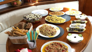 Enjoy a freshly prepared meal on board with stunning ocean views