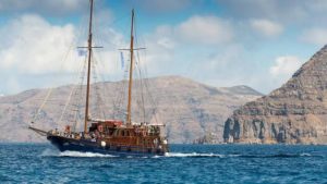The traditional boat that departs from the old port in Fira with destination the Volcano