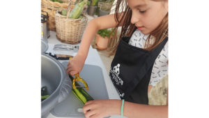 Children are given simple cooking assignments that are not difficult to complete