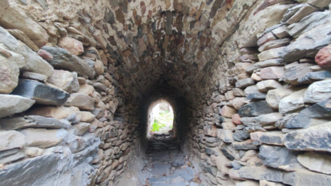 A tunnel made of stone, offering a glimpse into the architectural history of Naxos