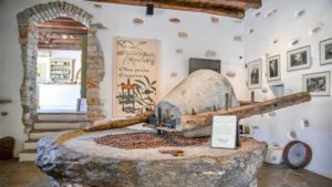 Explore the restored olive press museum, gain knowledge about the traditional methods of olive oil production