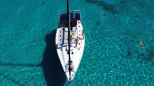 Sail into the serenity of the open sea at dusk