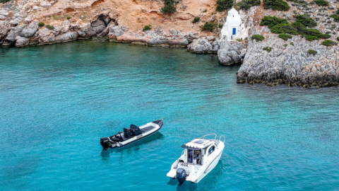 A RIB and a speedboat at anchorage