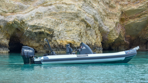 The powerful RIB motorboat near the coastline