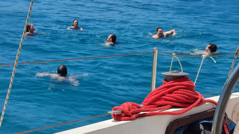 Jump off the boat and swim