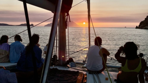 Sail into the sunset on a private catamaran with wine in hand