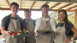 A group of guests is proud of what they cooked