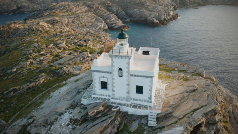 A lighthouse on the top of a hill