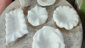 Discover the ancient art of marble carving in a peaceful outdoor workshop setting