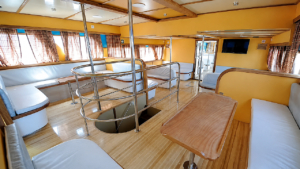 Some boats on the service offer simple seating in rows while others provide additional couches and tables