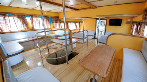 Some boats on the service offer simple seating in rows while others provide additional couches and tables