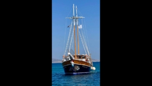 Freedom boat, sailing in the blue waters of the Cyclades