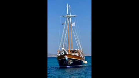 Freedom boat, sailing in the blue waters of the Cyclades
