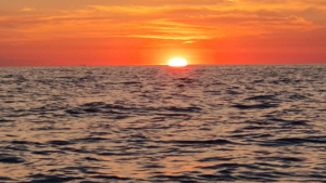 Watch the golden sunset unfold over the Aegean Sea