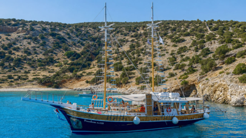 The boat docked outside Rina cave