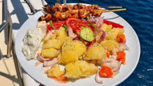 Fresh Greek lunch served on board during the full-day cruise from Naxos