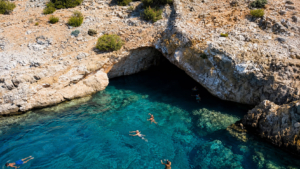 The crystal clear waters around of Rina cave in south Naxos